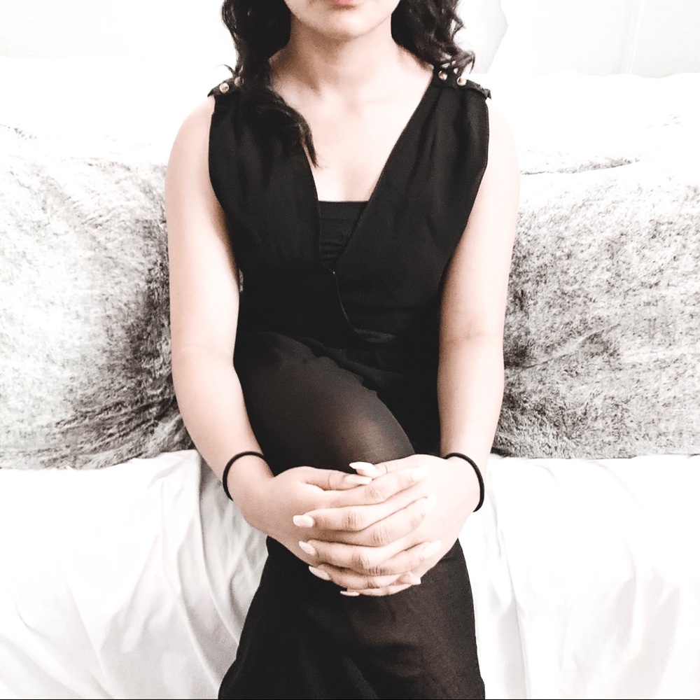 Black jumpsuit with gold accents